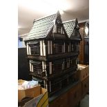 A large dolls house 'The Manor Hotel' and accessor