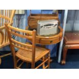 A reproduction mahogany drum table, side chair and a magazine rack