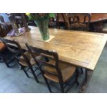 An oak Refectory table and four chairs