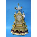 A gilt metal and marble mantle clock