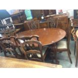 A mahogany extending dining table and six chairs
