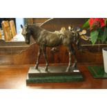 A bronzed horse after Barye, on green marble base