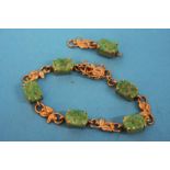 A 9ct gold and jade set bracelet
