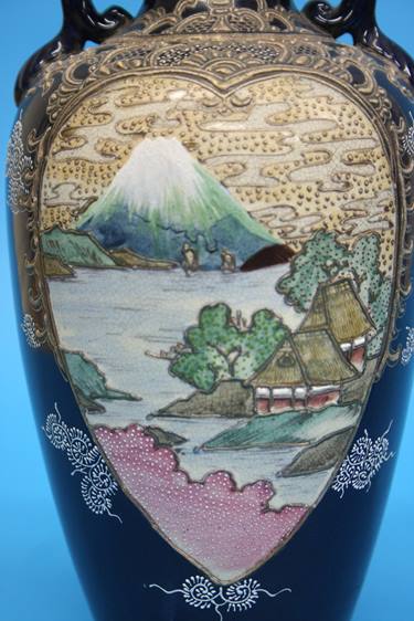 A pair of 1920/1930's Satsuma vases decorated with panels of landscapes etc. 25cm height - Image 16 of 24