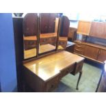 A triple mirror dressing table