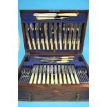 A canteen of cutlery in an oak case