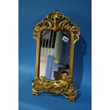 An Art Noveau style gilt easel mirror