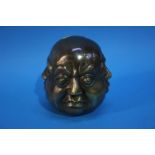 A four faced brass Buddha's head