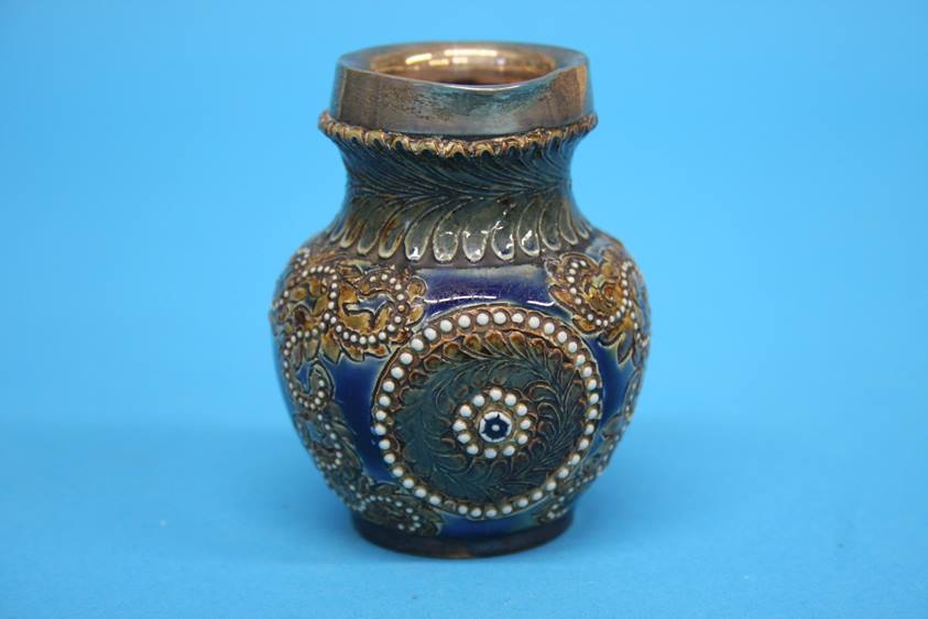 A Doulton Lambeth stoneware 'Gladstone jug', a small siver rimmed jug, a Royal Doulton Series Ware - Image 6 of 10