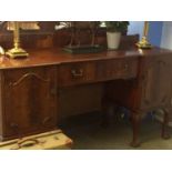 A mahogany breakfront sideboard with claw and ball feet