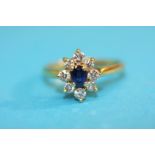 An 18ct gold ring with central sapphire and eight