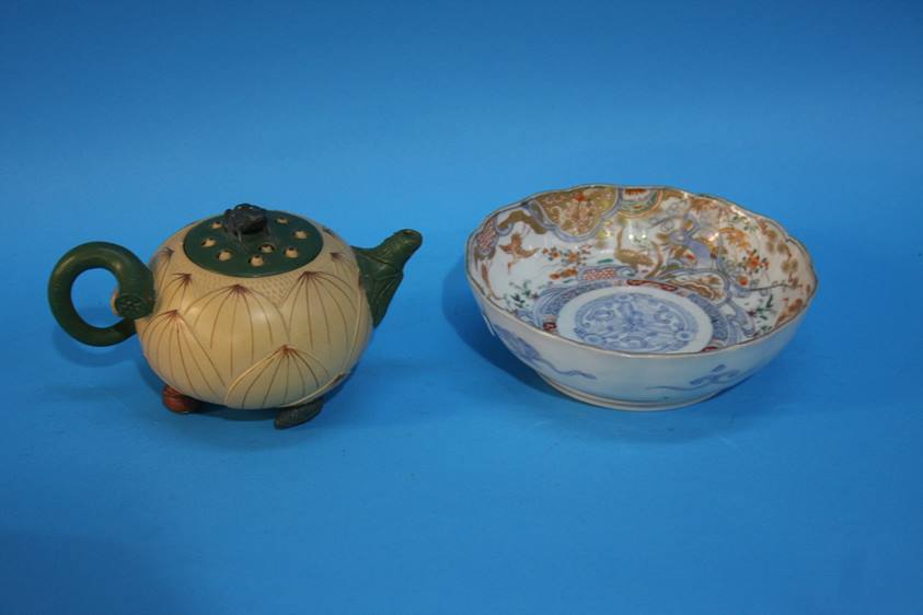 A small Oriental tea pot and bowl
