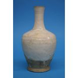 A Song Dynasty Cizhou bottle vase with cream glaze, the lower part with buff unglazed body, 20cm