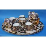 A Royal Crown Derby Imari pattern cabaret set comprising; tray, four tea cups and saucers, cream jug