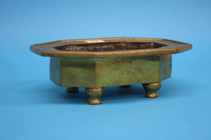 An early octagonal gilt bronze Chinese heavy censer on four strut feet, 19th century or earlier.