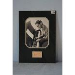Irving Berlin (1888-1989), mounted signature with black and white photograph