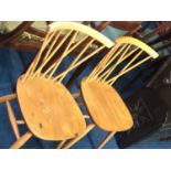 A pair of Ercol stickback chairs