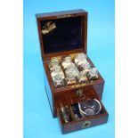 A good Apothecary travelling set, the top opening to reveal ten clear chemist bottles, below a