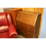 Teak chest of drawers and oak bureau