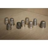 Nine various silver thimbles