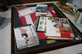 A framed signed Sunderland strip and associated books