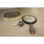 Silver backed brush, mirror and a rattle