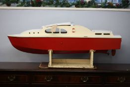 Model boat with red hull