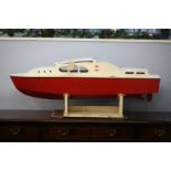 Model boat with red hull