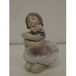Lladro figure of a young girl with flowers 12cm