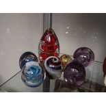Eight glass paperweights
