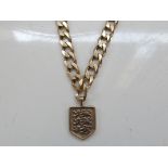 9ct gold curb chain with a 3 lions fob, 55cm long,