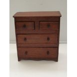 Victorian miniature chest of drawers, two short dr