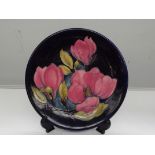 Moorcroft pottery plate, in the Magnolia pattern a