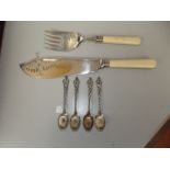 Four 830 grade silver spoons together with a pair