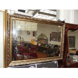 Large gilt framed bevelled mirror with etched deco