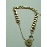 9 carat gold bracelet with safety chain and heart