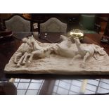 Large wall plaque in resin depicting four horses i