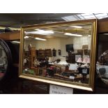 Gilt framed bevel edged mirror