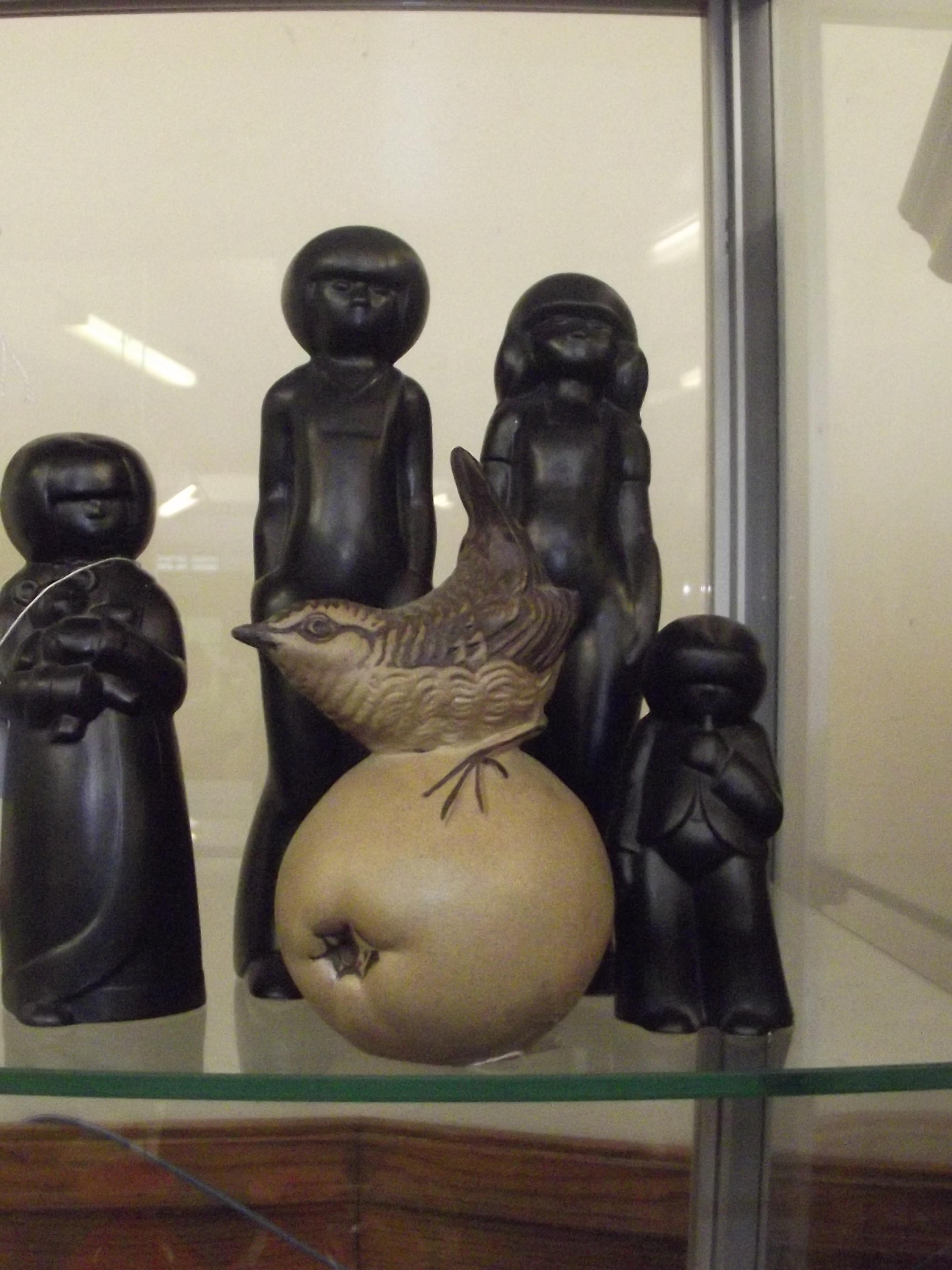 Four Hornsea figures together with a studio potter