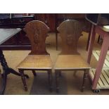 Pair of solid oak hall chairs