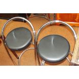 Two chrome and leather breakfast stools