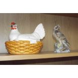 Hen basket and a ceramic falcon