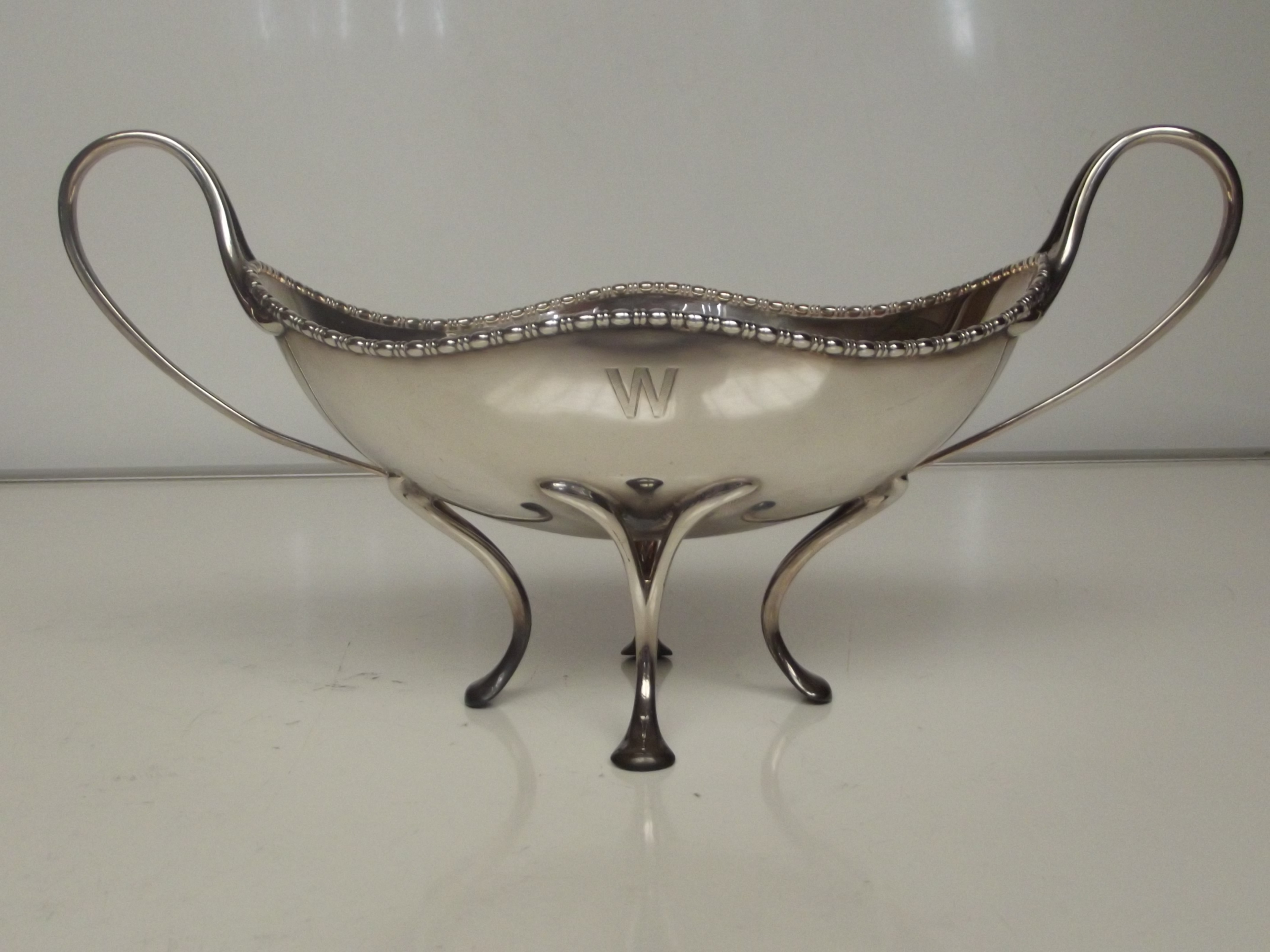 Art Nouveau silver twin handled bowl, sinuous hand