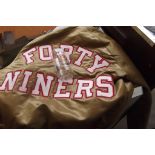 NFL 49'ers jacket together with a 49'ers glass