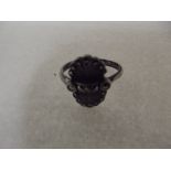 Silver ring with ornate fan design head set with m