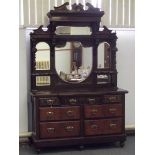 Victorian sideboard, the mirrored top with swan neck pediment having turned and carved supports. the