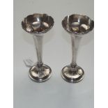 A pair of sterling silver bud vases