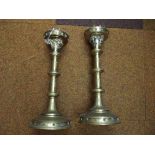 Pair of early church candlesticks