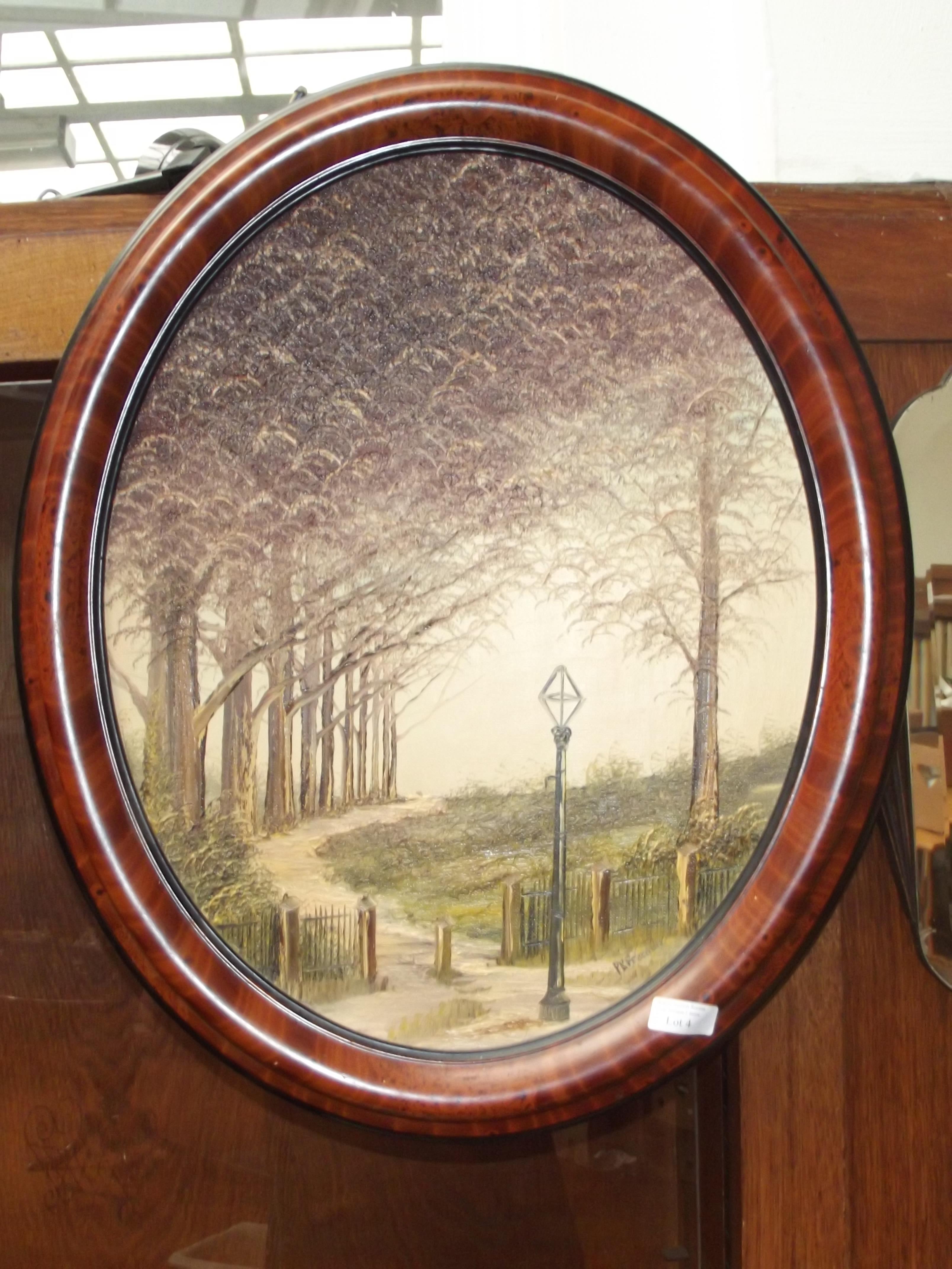 Oil on canvas set in a cameo shaped frame, signed