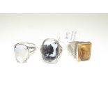 3x Silver rings - One with large white moon stone,